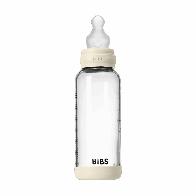 BIBS Glass Baby Bottle in Ivory, 240 ml, features a medium flow silicone nipple.