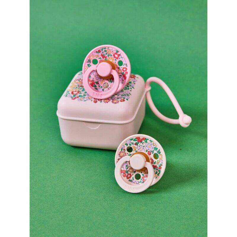 BIBS x LIBERTY Pacifier Box in Chloe Meadow - Ivory Mix and Oscar Meadow - Petal Mix with floral design and storage case.