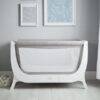 Shnuggle Air Cot Conversion Kit in Dove Grey, featuring a mesh side for breathability, set against a stylish nursery