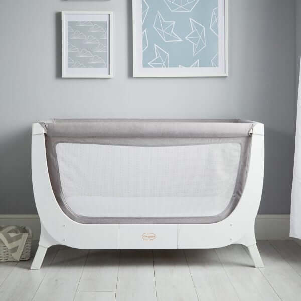 Shnuggle Air Cot Conversion Kit in Dove Grey, featuring a mesh side for breathability, set against a stylish nursery