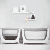 Shnuggle Air Bedside Crib in Dove Grey and Stone Grey, featuring mesh sides for breathability, set against a minimalist