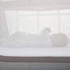 Shnuggle Air Cot Conversion Kit in Dove Grey, featuring a breathable mesh design with a baby lying comfortably inside.