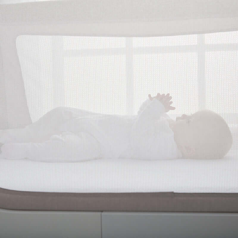 Shnuggle Air Cot Conversion Kit in Dove Grey, featuring a breathable mesh design with a baby lying comfortably inside.