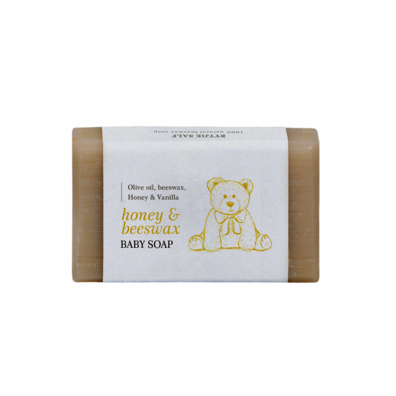 Bytjie Salf Honey & Beeswax Handmade Baby Soap, featuring a teddy bear design on the label, in a soft beige color.