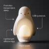 Tommee Tippee Penguin Night Light in soft white, featuring a USB-powered design with a lightweight silicone body.
