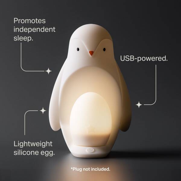 Tommee Tippee Penguin Night Light in soft white, featuring a USB-powered design with a lightweight silicone body.