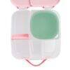 b.box lunch tub in berry smoothie with a green compartment, featuring multiple sections and a pink handle for easy transport.
