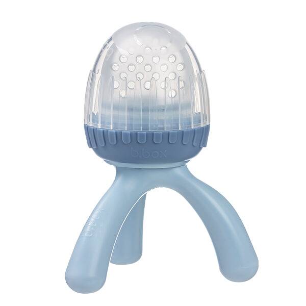 b.box Silicone Fresh Food Feeder in blush and lullaby blue with a unique three-legged design for easy grip.