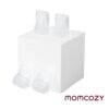 Momcozy M6 Duckbill Valves - 4 pack, clear silicone valves displayed on a white cube, designed for breast pumps.