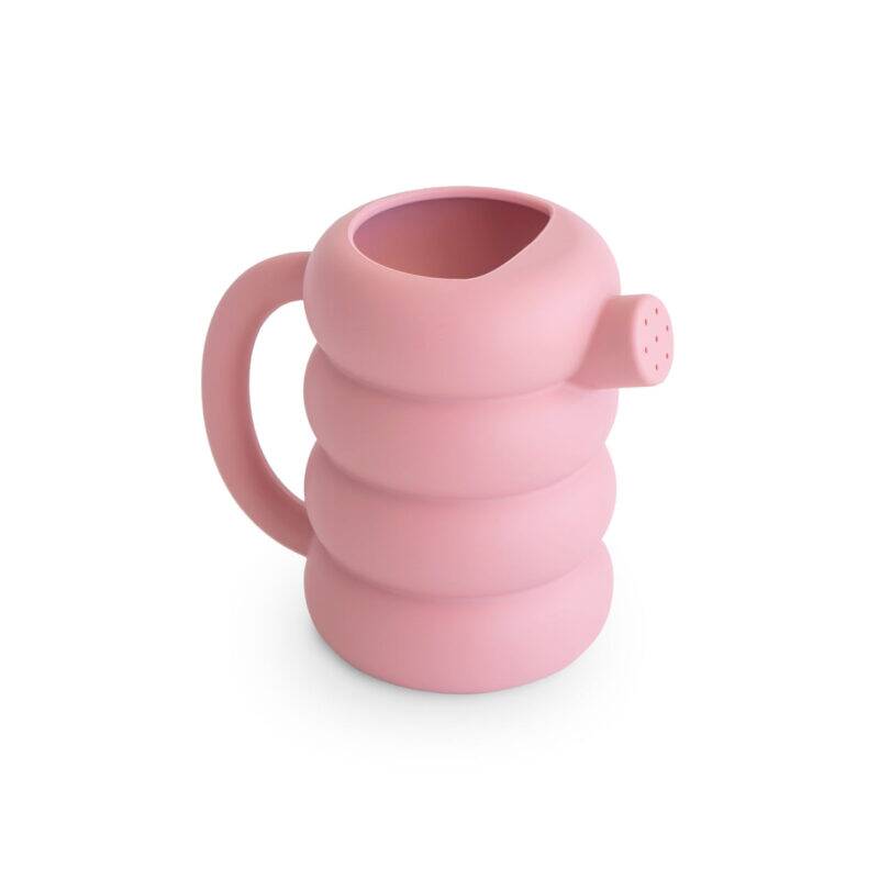 Mushie Silicone Watering Can in Peony, featuring a unique rounded design and easy-grip handle.