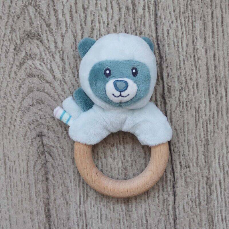 Back to Nature Wood Ring Rattle featuring a plush raccoon head in blue and pink with a natural wood ring.